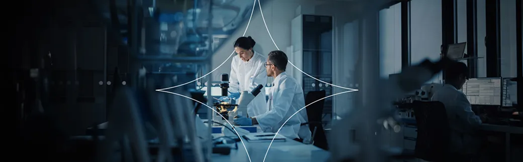 Scientists conducting cancer research in a modern laboratory.